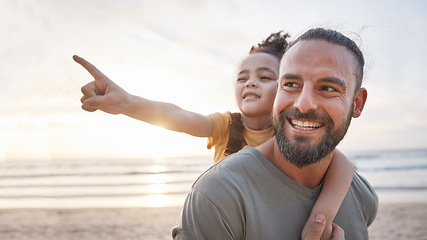 Image showing Beach, sunset and father carrying his child for a walk on a family summer vacation or holiday. Adventure, explore and girl kid pointing at the view and bonding with dad by the ocean on a weekend trip