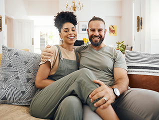 Image showing Home, love and couple on a couch, portrait or marriage with happiness, bonding and relax in lounge. Interracial, man or woman on a sofa, trust and romantic with relationship, commitment and dating