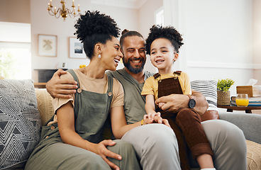 Image showing Smile, relax and an interracial family on the sofa for conversation, love and bonding. Happy, house and a mother, father and a boy child on the couch for talking, care and together for communication