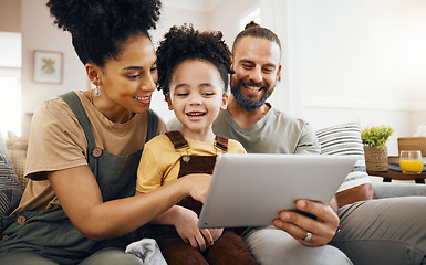 Image showing Family, tablet and parents with child relax on couch, bonding and happy streaming together at home. Smile, love and care with tech, gaming or movies with e learning and man with woman and son