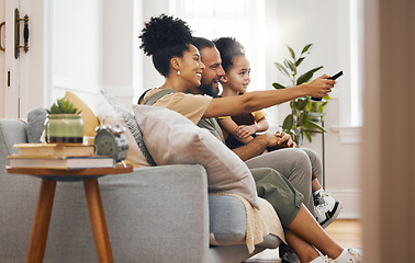 Image showing Television, relax and family on a sofa for movie, bond and cartoon, film or program at home. Love, remote control and boy child with parents in living room watching tv or streaming subscription