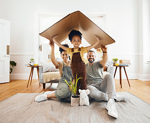 Image showing Portrait, family and a boy with cardboard for insurance in the living room of their home together. Mother, father and daughter in a house for security or safety in real estate and property finance