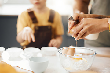 Image showing Hands, crack egg and cooking in kitchen on bowl on table with family in home. Food, bakery and break eggshell for ingredient in flour for healthy diet, protein nutrition and preparation of pastry.