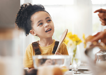 Image showing Child in kitchen, baking and learning with parent, wooden spoon and cake flour on face, little baker making breakfast or cookies. Cooking, food and happy boy in home with mixing bowl, tools and smile