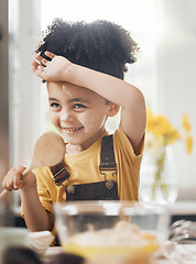 Image showing Child in kitchen, baking with wooden spoon and cake flour on face, little baker making breakfast or cookies. Learning, cooking and happy boy chef in home with mixing bowl, tools and smile in morning.