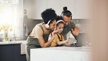 Image showing Interracial parents, kid and video call with laptop, headphones and wave hello with smile in kitchen. Mother, father and child with computer, happy and contact with webinar with chat in family home