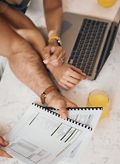 Image showing Hands, documents and laptop with a couple in the kitchen to budget for finance, investment or savings in a home from above. Computer, paper or planning with a husband and wife reading info to bank