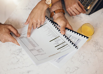 Image showing Hands, documents and a couple in the kitchen to budget for finance, investment or savings in a home from above. Paper, insurance or planning with a husband and wife reading information for accounting