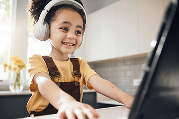 Image showing Headphones, tablet and kid elearning in home, happy and online education for homeschool. Excited, technology and boy child on video call, studying on internet and listening to music in virtual class