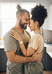 Image showing Interracial couple, hug and forehead touch in kitchen, love and bonding with happiness while at home. Trust, support and commitment, affection and embrace with people in a healthy relationship