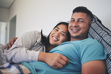 Image showing Portrait, bed or happy couple hug in house with smile, care or support while bonding to relax together. Morning, man or woman lying in home bedroom with love, peace or loyalty in marriage commitment