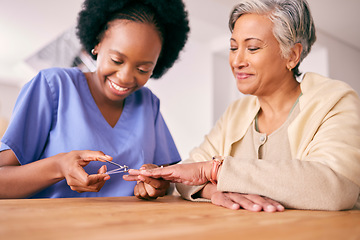 Image showing Manicure, elderly woman and nurse in retirement cut nails on table for spa day, selfcare and wellness. People, smile and caregiver in nursing home take care of senior hands for support and help