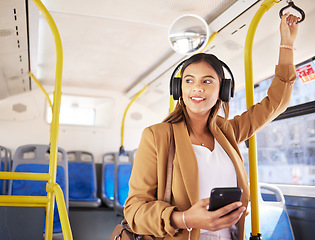 Image showing Bus, woman and phone with headphones on public transport, music and smile with business commute. City travel, stop and internet app of a female professional on a mobile with networking on metro