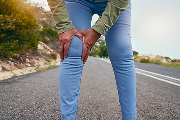 Image showing Knee pain, road and fitness of a senior person with massage and sport injury from exercise. Street, running and path of a athlete with joint inflammation, muscle issue and hands on leg outdoor