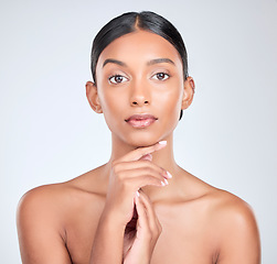 Image showing Studio portrait of Indian woman for skincare, beauty and cosmetics on white background for salon aesthetic. Dermatology, spa and serious face of isolated person for wellness, glamour and facial glow