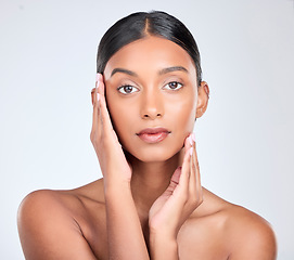 Image showing Beauty, portrait and Indian woman in studio for skincare, facial and cosmetics on white background. Dermatology, salon and face touch of isolated person for wellness, satisfaction and facial care