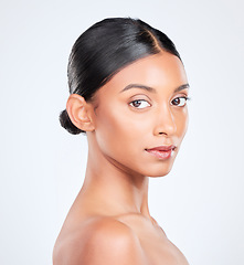 Image showing Dermatology, beauty and portrait of Indian woman in studio for wellness, healthy skin and facial care. Skincare, salon and face of person isolated with makeup, cosmetics and glow on white background