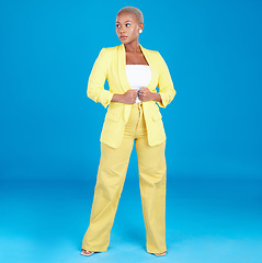 Image showing Corporate, business woman and entrepreneur in studio assertive for career, job and startup on blue background. Professional, fashion and creative young person with confidence, pride and ambition