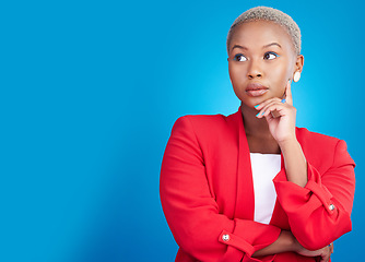 Image showing Entrepreneur, thinking and black woman with a decision on studio, blue background or mockup with ideas for career. Startup, choice or person with question, doubt or professional mind for business