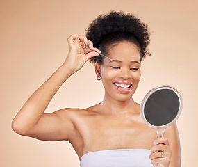 Image showing Woman, tweezers and mirror for eyebrow in studio, beauty or thinking for results, reflection or idea by background. African girl, model and smile for facial hair removal, inspection or transformation