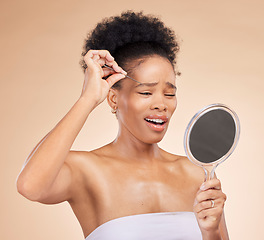 Image showing Woman, tweezers and mirror for eyes in studio, beauty or thinking with results, reflection and pain by background. African girl, model and smile for eyebrow removal, inspection and transformation