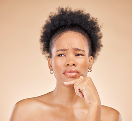 Image showing Skincare, choice and black woman in thinking in studio with choice, question or why on brown background. Confused, face and African lady model with decision, emoji or choose beauty wellness treatment