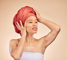 Image showing Hair, scarf and black woman in studio for wellness, beauty or natural cosmetics on brown background. Headwrap, pride and African lady model with glowing or skincare satisfaction, results or treatment