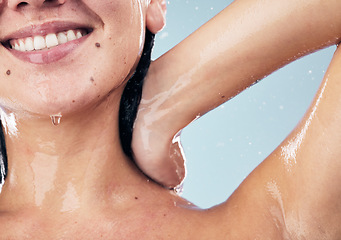 Image showing Shower, smile and woman in studio for body care, wellness and cleaning on blue background. Hygiene, skincare and happy female model with in a bathroom for hair, cosmetics and relax while washing