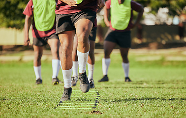 Image showing Sports, running and men for rugby training, workout and exercise on grass field for competition. Fitness, teamwork and feet of athletes with equipment outdoors for match practice, challenge and game