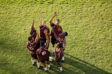 Image showing Raised hand, sports and rugby people celebrate teamwork, team building or winning game, match or tournament competition. Success motivation, top view winner and circle of men happy, excited or cheers
