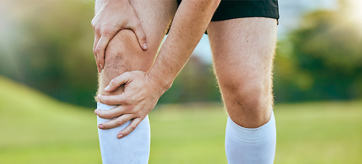 Image showing Knee pain, legs and sports person tired, fatigue and hurt from outdoor competition, fitness challenge or workout run. Training mistake, athlete burnout or closeup player with medical emergency crisis