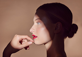 Image showing Woman, makeup and profile with spotlight and beauty in shadow with creative aesthetic in studio background. Light, female model and thinking about cosmetics with mystery, art or style in skincare