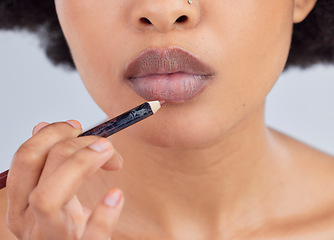 Image showing Makeup, beauty and lips of woman with pencil in studio for wellness, skincare product and cosmetics. Salon, aesthetic and face zoom of person with lipstick or lip liner for glamour, makeover and glow