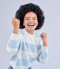 Image showing Black woman, portrait and fist in studio for success, celebrate deal and winning lottery bonus on white background. Excited model, cheers and happy celebration of achievement, freedom or lotto winner