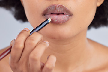 Image showing Makeup, cosmetics and lips of woman with pencil in studio for wellness, skincare product and beauty. Salon, aesthetic and face zoom of person with lipstick or lip liner for glamour, makeover and glow