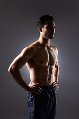 Image showing Muscle, body and studio man with fitness challenge results, bodybuilder progress and strong transformation training. Dark shadow, exercise and confident sports athlete thinking on grey background