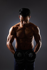 Image showing Muscle, dark studio and man with dumbbell challenge, arm workout development and training determination. Bodybuilder progress, gym equipment and sports person doing weightlifting on grey background