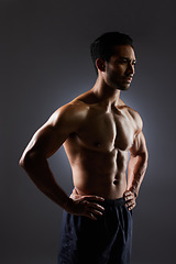Image showing Muscle, dark studio and man with training challenge, workout and fitness determination, motivation or strength commitment. Body builder progress, thinking athlete and sports person on grey background