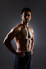 Image showing Confidence, muscle and portrait of man on dark background for fitness inspiration, beauty aesthetic or strong body. Shadow aesthetic, male sports model or muscular bodybuilder in studio lighting.