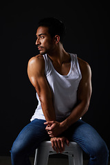Image showing Thinking, muscle and sexy man on chair in studio with fitness inspiration, beauty aesthetic and sensual fashion. Erotic art, sexual body and male model sitting on black background with dark lighting.