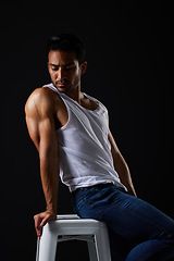 Image showing Beauty with sexy, muscular man on chair in studio and fitness inspiration, aesthetic and sensual fashion. Erotic art, sexual body and male model sitting on black background, thinking in dark lighting