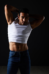 Image showing Fitness, fashion and muscle with man in studio for strong, body and health. Sports, wellness and workout with person and remove tshirt on dark background for bodybuilder, gym and athlete motivation