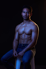 Image showing Topless, portrait and sexy man in neon studio for fitness inspiration, beauty aesthetic or sensual fantasy. Erotic art, sexual body and male model with muscle, black background and dark blue lighting