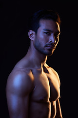 Image showing Shirtless, portrait and sexy man on black background in fitness inspiration, beauty aesthetic or sensual fantasy. Erotic art, sexual body or seductive male model with muscle, studio and neon lighting