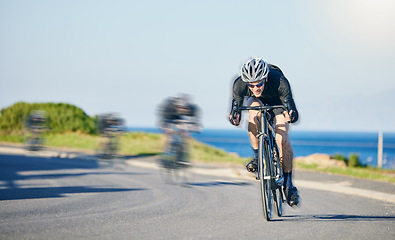 Image showing Motion blur, race and cyclist on bike on road in mountain with helmet, exercise adventure trail and speed. Cycling action , nature and men with bicycle for fast workout, training motivation or energy