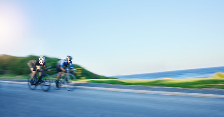 Image showing Blur motion, sports and people cycling on bicycle for race, competition or marathon training. Fitness, fast and team of athlete cyclists riding a bike for speed practice on a mountain road in nature.