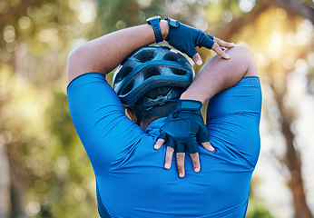 Image showing Man, cyclist and stretching arms in nature in sports fitness, workout or outdoor exercise for wellness. Active male person, back or athlete in warm up, cycling or ready for training or adventure