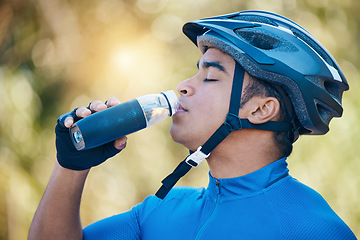 Image showing Nature, cycling or man drinking water in training, workout or cardio exercise on a fitness break. Relax, fatigue or tired sports cyclist with healthy liquid for hydration after riding on woods trail
