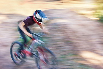 Image showing Blurry motion, fitness and man cyclist on bicycle for race, competition or marathon training. Sports, fast and man athlete cycling on a bike for speed practice challenge on a mountain hill in nature.