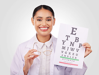 Image showing Portrait, glasses and eye test with a woman optician in studio on a gray background for vision or eyesight. Face, smile and a happy young doctor in a clinic or optometry office for a medical exam